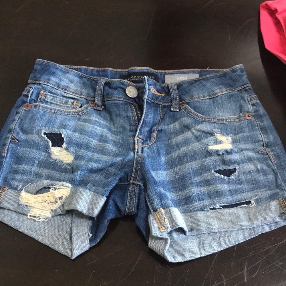 Distressed midi jean shorts